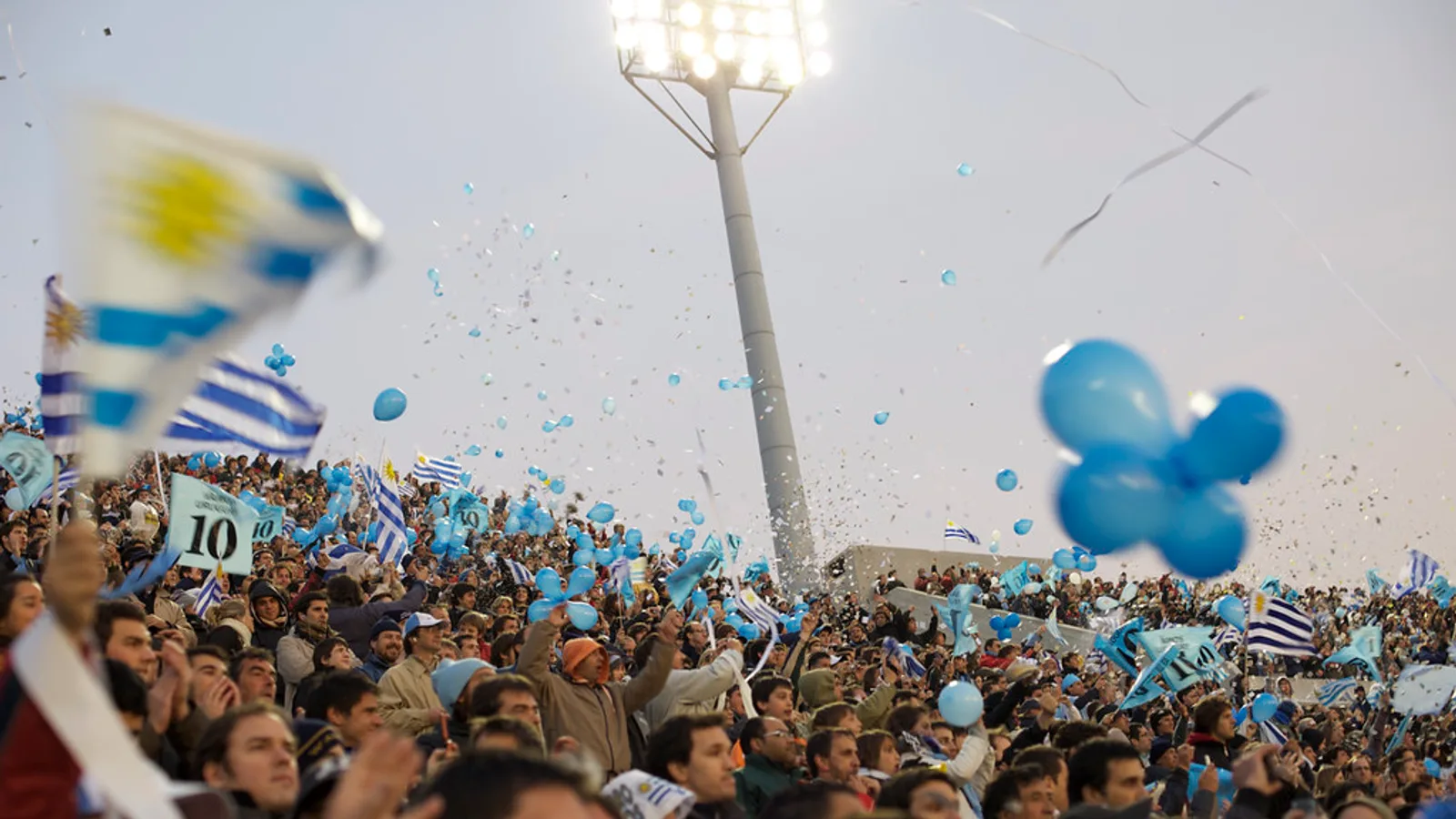Argentine football fans chanting in the stands, the setting where dale in Spanish to English means "let's go"